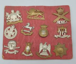 A collection of eleven WWI cap badges