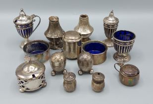A Birmingham silver three piece condiment set, together with other silver condiments, 8ozs