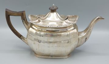 A Sheffield silver teapot of shaped form with ebonised handle, 20ozs