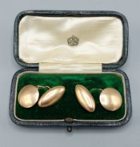 A pair of 15ct gold cufflinks within a fitted box, 9.8gms