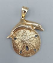 A 14ct gold pendant in the form of a Dolphin, 11.4gms