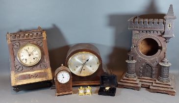 A 19th Century oak Gothic revival mantle clock case together with various other clocks and parts