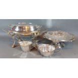 A silver plated entree dish on stand together with a plated fruit basket, sucrier and cream jug