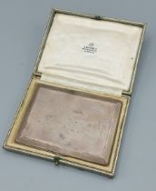 A London silver cigarette case By Asprey London, with engine turned decoration, within original