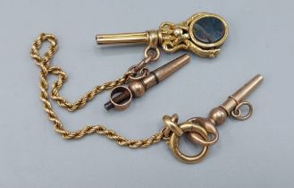 A 19th Century swivel key fob together with two watch keys and a small guard chain, 11.2gms