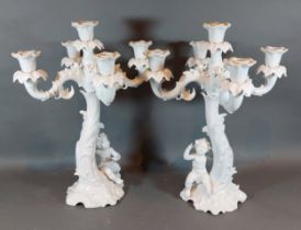 A pair of Bavarian porcelain candelabrum with figural columns, 37cms tall