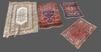 A Northwest Persian woollen small rug together with three similar Northwest Persian woollen rugs