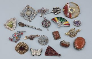 A Scottish stone set brooch together with a collection of brooches