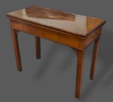 A 19th Century mahogany rectangular card table, the moulded hinged top enclosing a baize lined
