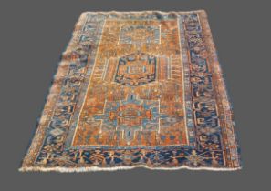 A Northwest Persian woollen rug with an all-over design within multiple borders, 186cms x 128ms