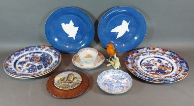 An early English tea bowl and saucer, together with a pot lid, two wedgwood plates, a Geobels