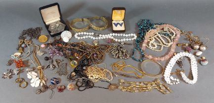 A collection of jewellery to include bangles, necklaces and brooches