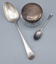 A George III silver table spoon, 1798 together with a silver teaspoon and a silver topped dressing