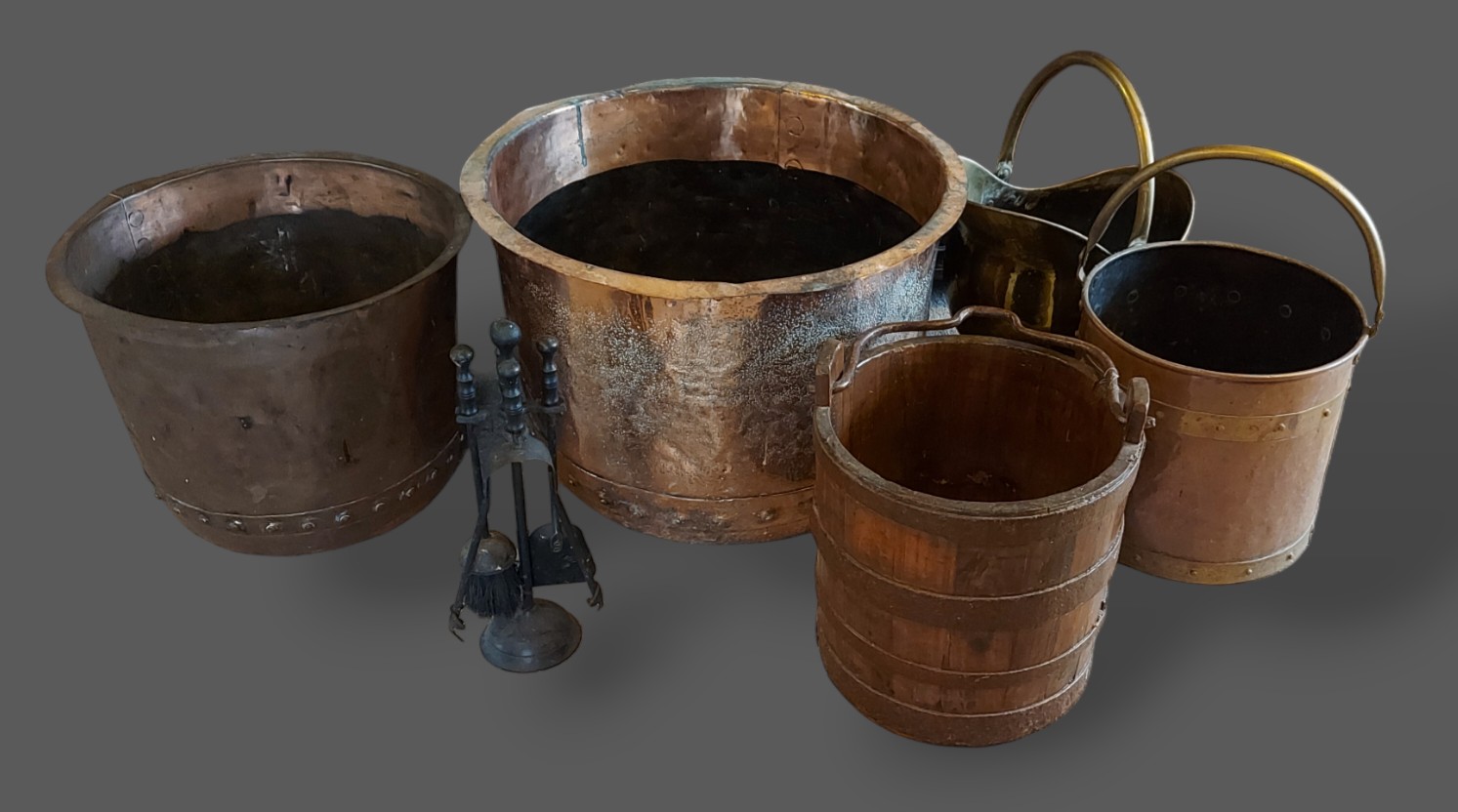 A large circular copper log bin, 59cms diameter, together with another smaller log bin, a metal