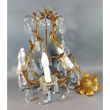 A gilded metal and cut glass four branch light fitting, 42cms long