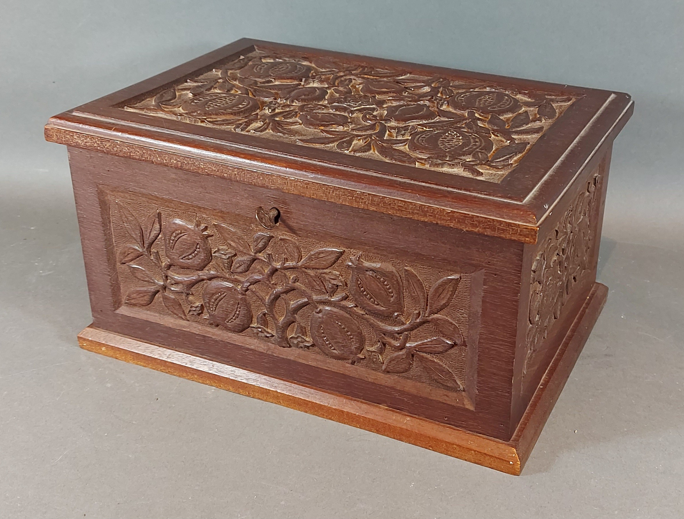 A Victorian wooden work box with carved decoration, with hinged lid and inner tray, 30cms wide by