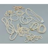 A collection of pearl and bead necklaces