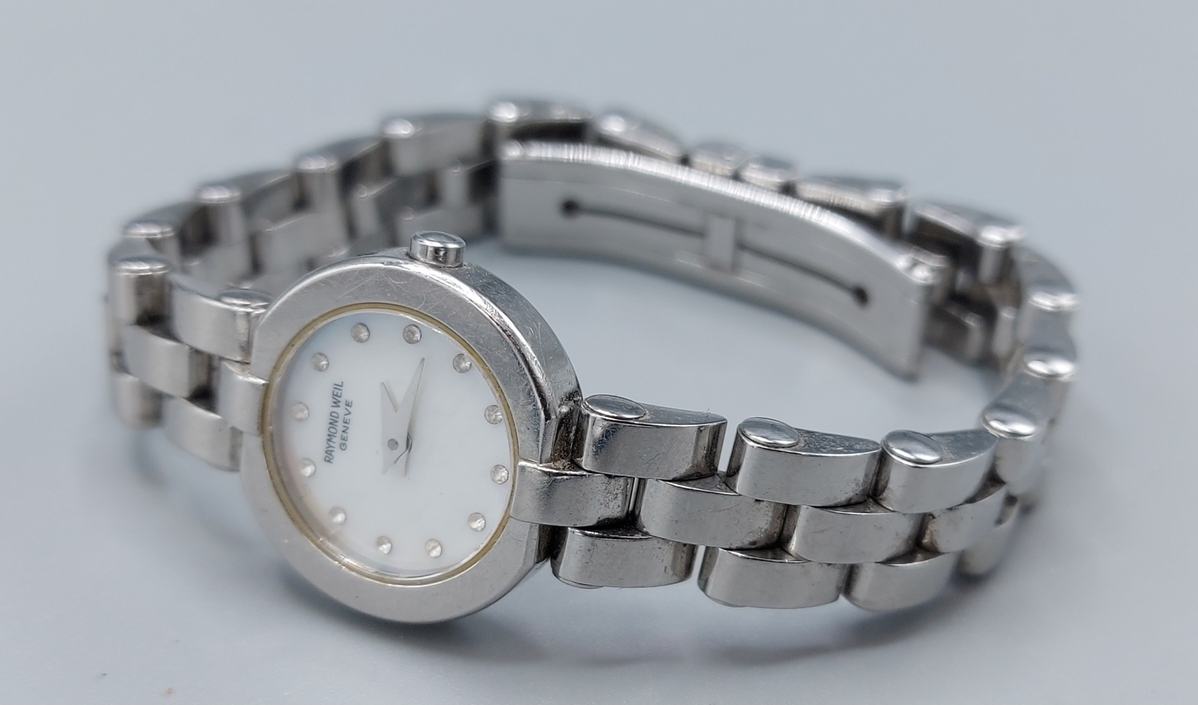 A stainless steel cased ladies wristwatch by Raymond Weil, the M.O.P. dial set with Diamond markers,