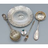 An Indian white metal dish together with a 925 silver pill box, a Russian silver sugar sifter spoon,