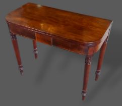 A 19th Century mahogany tea table, the hinged top above turned legs