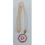 A 9ct gold pendant of flower head design set with diamonds and rubies, together with a 9ct gold fine