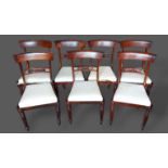 A set of seven William IV Rosewood dining chairs, each with a carved rail back above a drop in