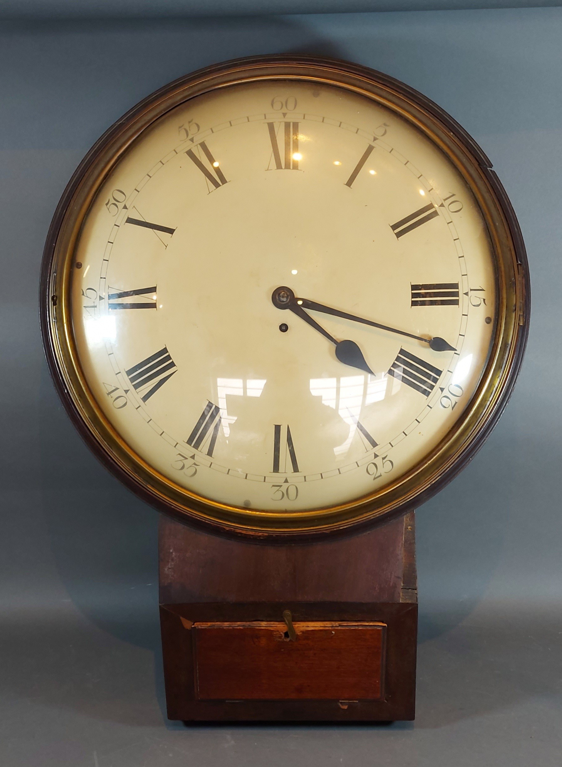 A mahogany cased drop dial wall clock, the enamel dial with roman numerals and with single fusee