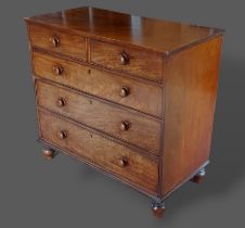 A 19th Century mahogany straight front chest of two short and three long drawers with knob handles