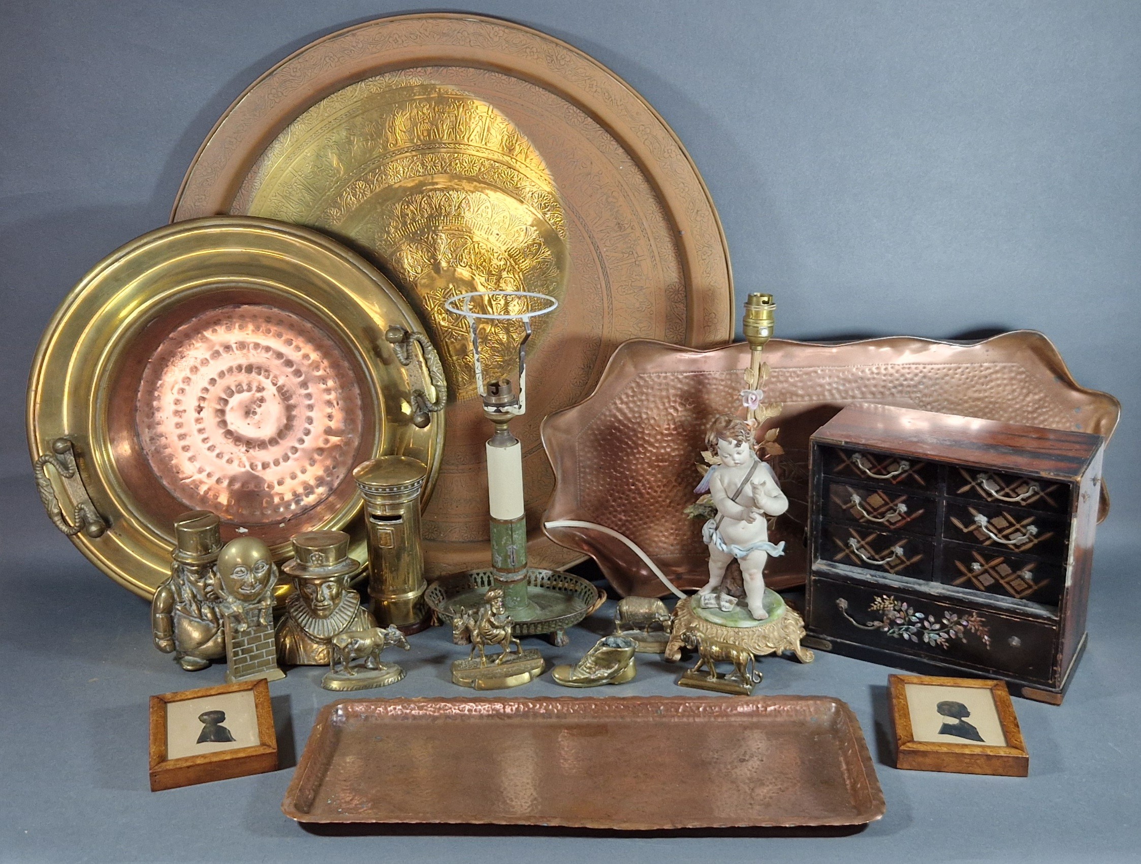 A toleware lamp base together with other items to include a brass tray and a collection of brass