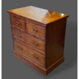 A late Victorian mahogany straight front chest of two short and two long drawers raised upon a