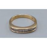 An 18ct gold Baguette Diamond half Eternity ring, 3.9gms, ring size P