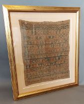 A George III wollwork sampler dated 1813, 29cms X 25cms