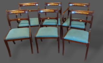 A set of six carved rail back dining chairs, together with a twin pillar extending D end dining