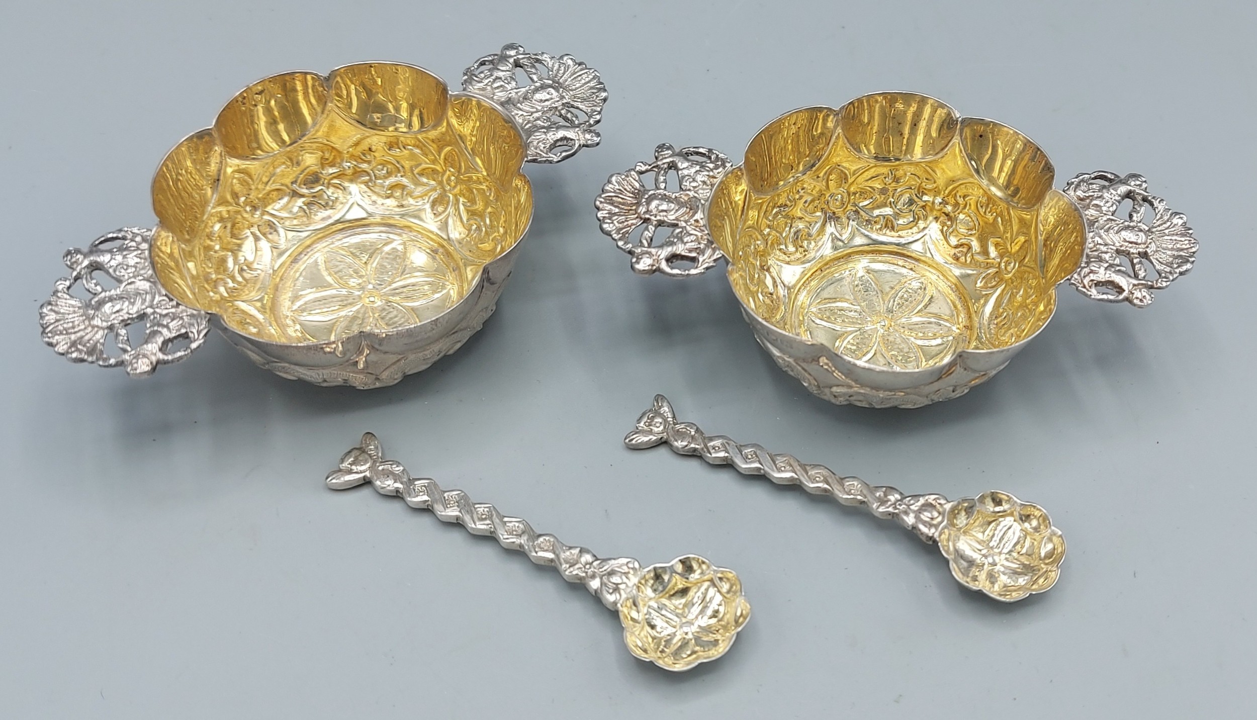 A pair of Victorian silver two handled salts with embossed decoration, London 1896 maker William