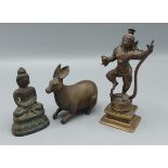 An Indian bronze figure with snake, 13cms tall, together with a bronze Buddha and a Bronze model