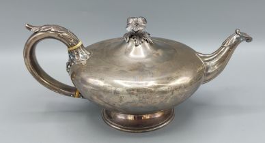 A William IV silver tea pot with embossed decorated handle and spout, London 1835 marker Charles Fox