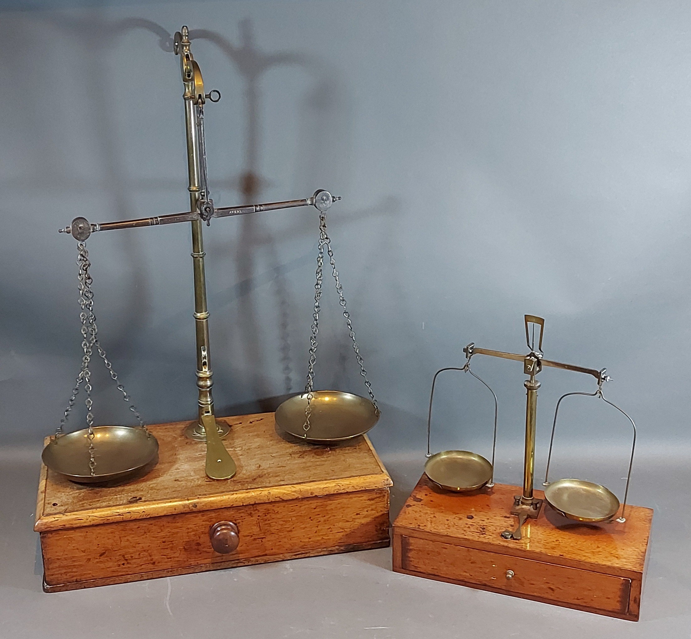 A set of brass and steel balance scales marked Avery with mahogany box base together with a