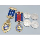 A silver gilt and enamel masonic jewel, together with another similar jewel and four crowns