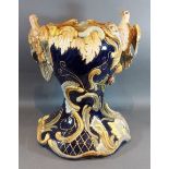 A Majolica jardinier with bird surmount decorated in polychrome enamels, 44cms tall