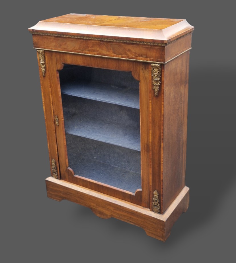 A Victorian inlaid walnut and gilt metal mounted pier cabinet with glazed door, 78cms wide by