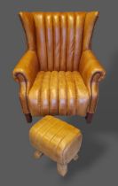 A tan leather upholstered wing back armchair raised upon square tapered legs together with a similar