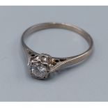 An 18ct white gold solitaire Diamond ring, 2.4gms, ring size R