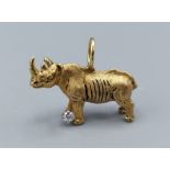 An 18ct gold pendant in the form of a Rhinoceros set with a solitaire Diamond, 13.8gms