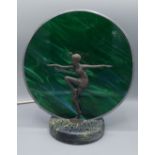 An Art Deco style table lamp mounted with a dancing lady and with a circular mottled glass shade