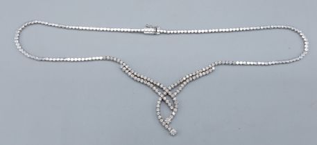 An 18ct white gold Diamond set necklace of interwoven linked form, 28gms, 41cms long