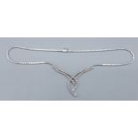 An 18ct white gold Diamond set necklace of interwoven linked form, 28gms, 41cms long