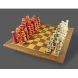 A Raynard the Fox large chess set upon an inlaid chess board