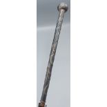 A Chinese white metal Parasol handle decorated with serpents, 101cms long