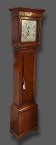 An oak longcase clock, the square hood above a rectangular door raised upon bracket feet, the