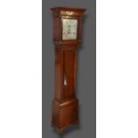 An oak longcase clock, the square hood above a rectangular door raised upon bracket feet, the